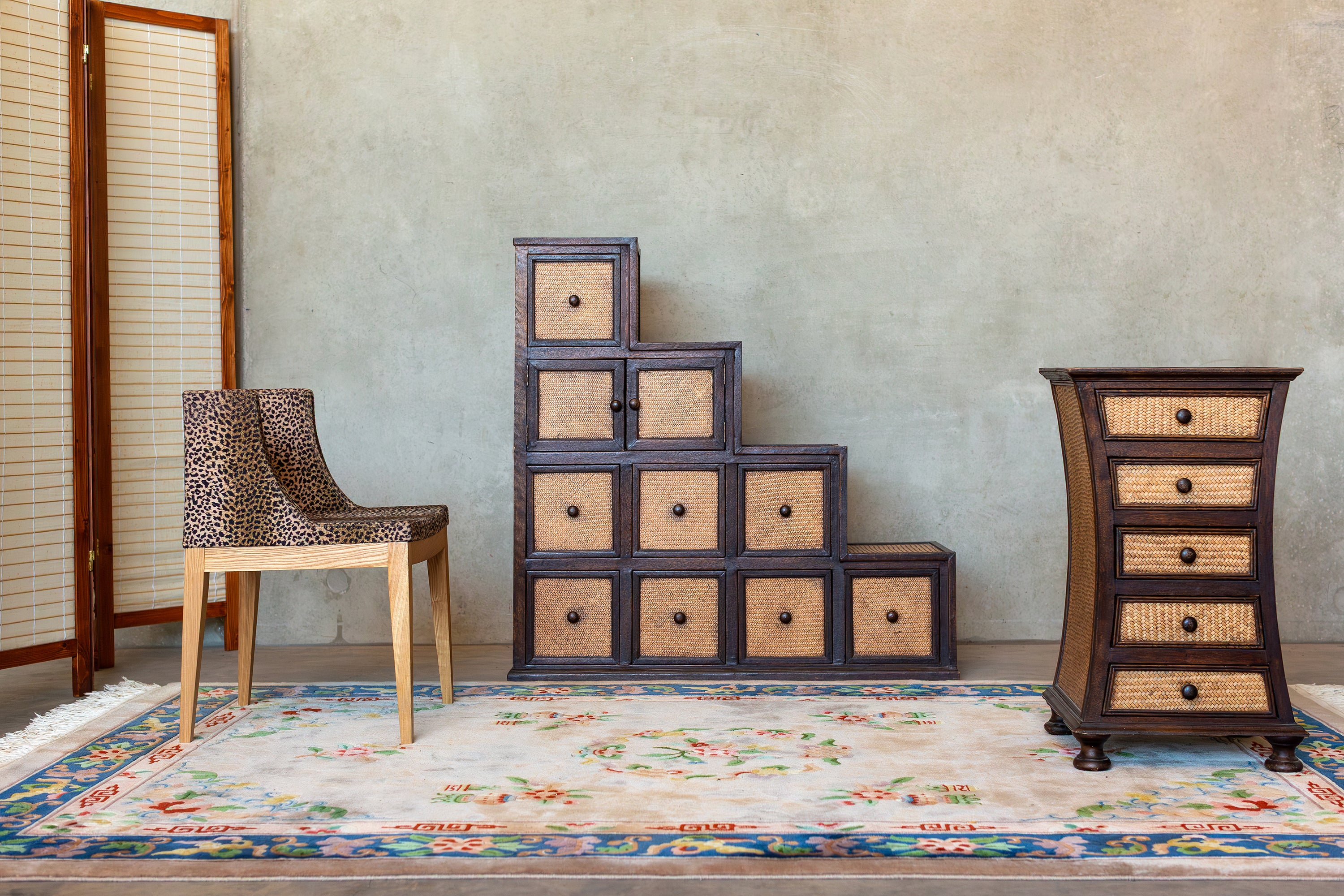 Vintage stepped cane storage unit with woven cane doors
