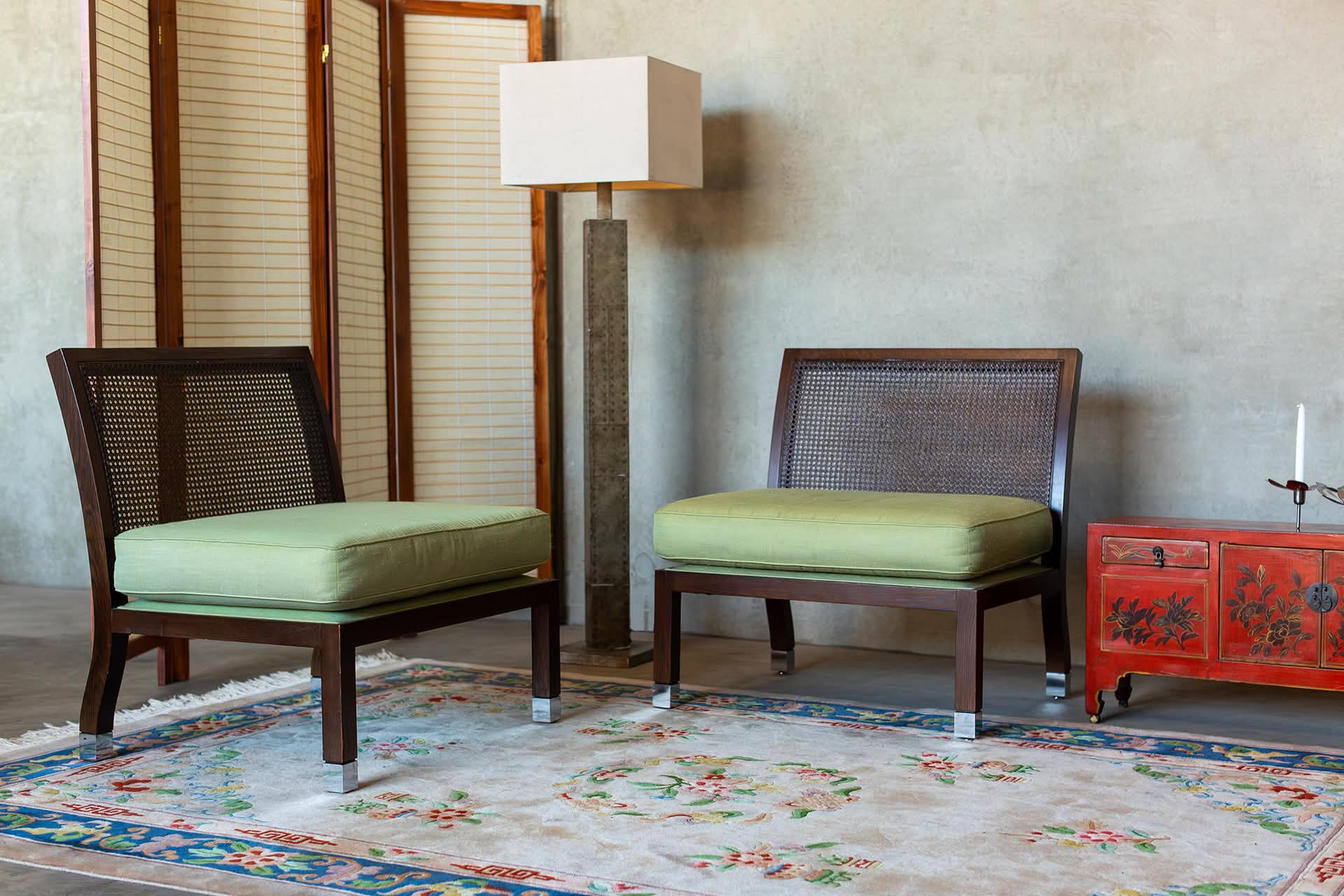 Pair of Andrew Parr cane lounge chairs with timber frames